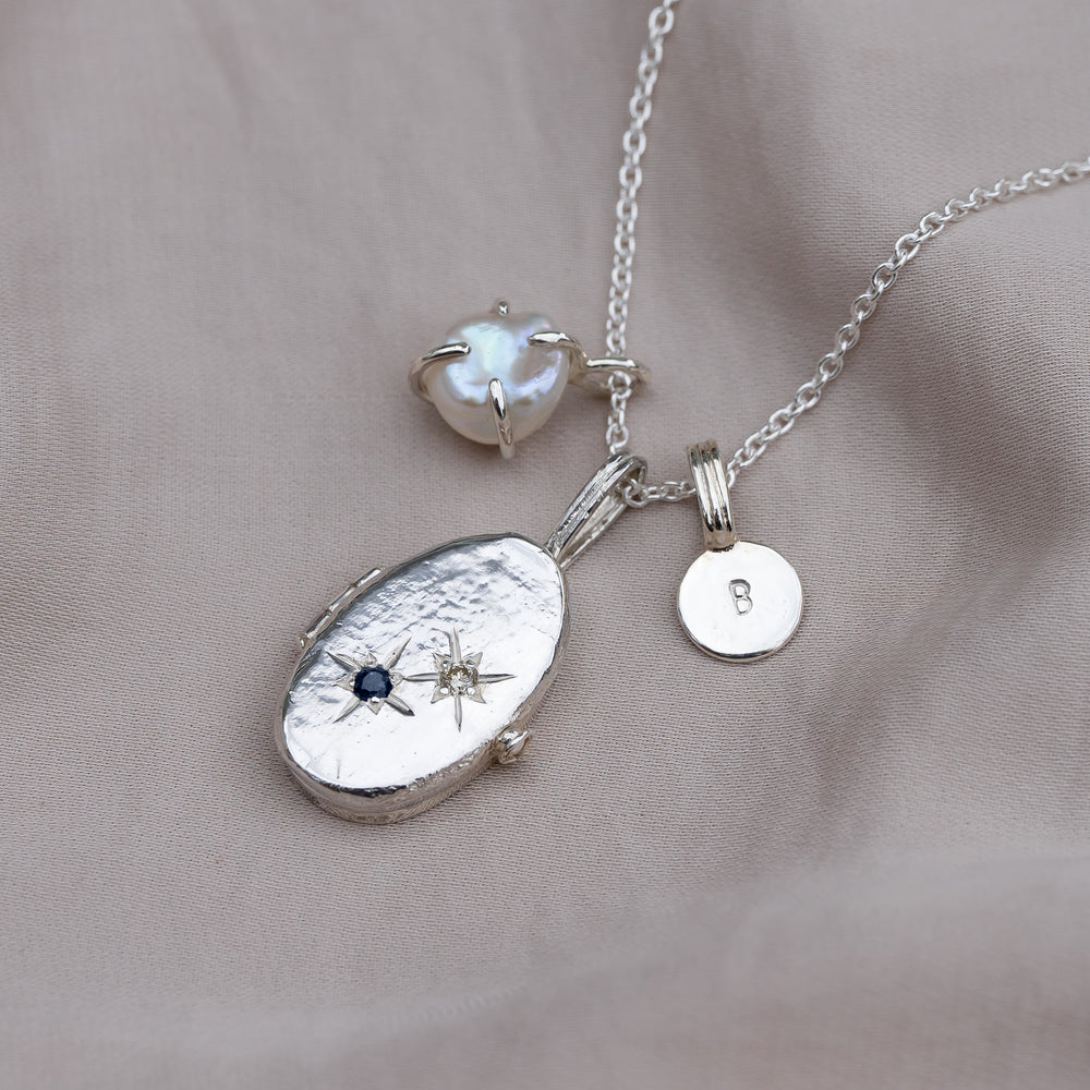 Sapphire and diamond, sterling silver and freshwater pearl.