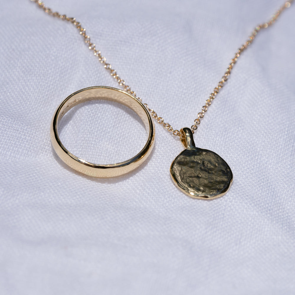 18ct yellow gold with engraving.